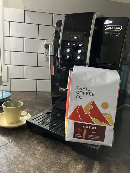 Picture of the bag of coffee beans I bought this past week from the Trail Coffee company. Also in the picture is my DeLonghi coffee machine and my (empty) espresso cup