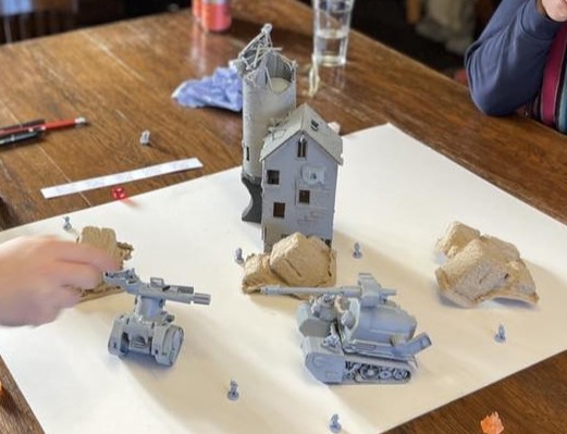 "Tonk" game mid play through... I used some of my scratch built 35mm D&D terrain and a slightly larger board, and it all seemed to work. The play through was great fun.

Here you can see the two "Tonks" on the board, both unpainted. Just primer grey.