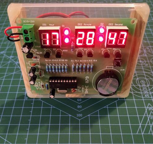 SH-E 879 digital clock running with the time set.