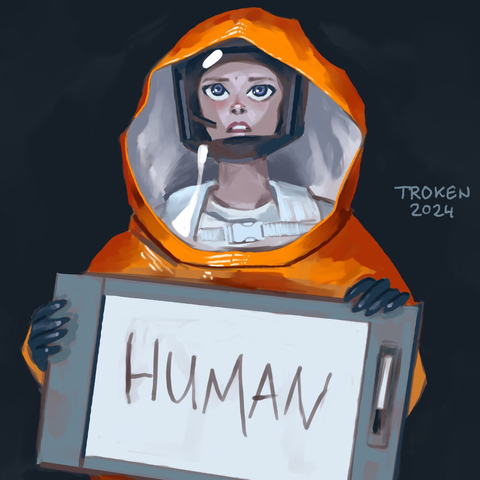 Woman in hazmat holding a sign with the word Human.