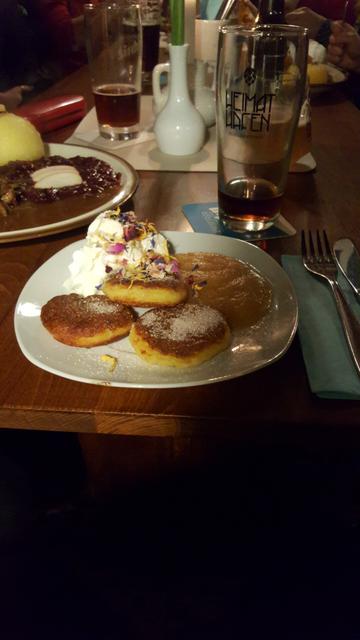 plate with delicious food, glass behind.