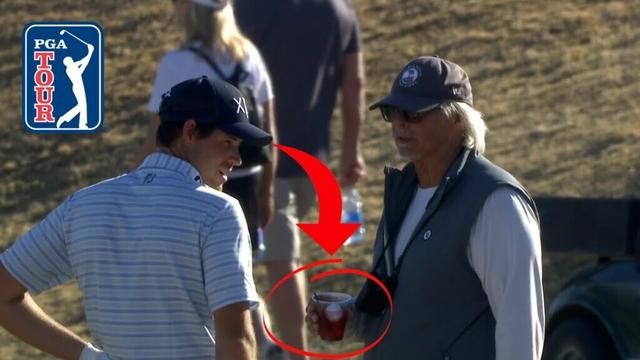 Adam Schenk makes birdie after his approach lands in a fan's drink at The American Express