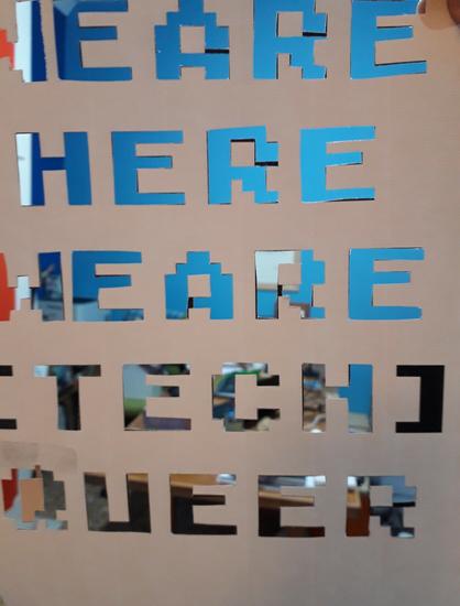 Letters stencil. Text reads: we are here, we are tech queer