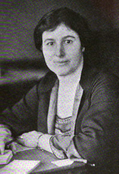 Frances Fenton Bernard (later Park), from a 1924 news photo; a white woman with dark hair, wearing a dark jacket, seated at a desk