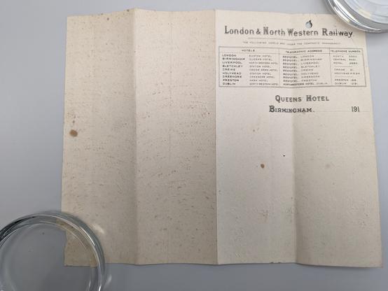 Cream paper with black printing in upper right corner.
Title: London & North Western Railway.
Followed by a list of railway hotels including Queens Hotel Birmingham.