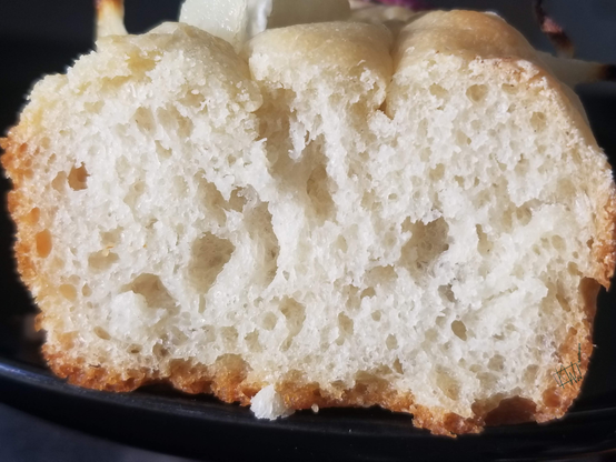 Slice of focaccia with a beautiful crumb.