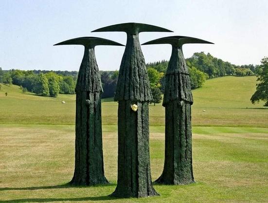 Three figure similar to before, but highly elongated. Their faces are covered, and one has their pale, white hands ungloved.