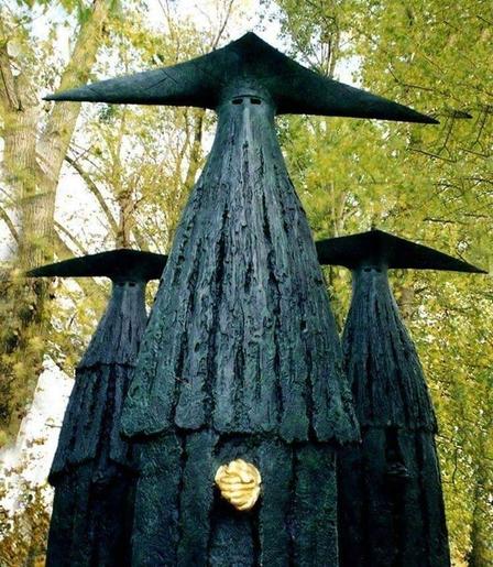As the previously, but the figures are standing in a wooded area.
