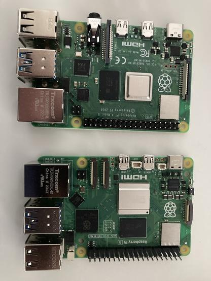 A Raspberry Pi 4, top, and Pi 5, bottom.