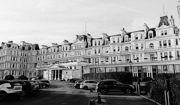 Hybrid mono photo showing the front of The Grand Hotel in Eastbourne, Sussex, UK. Part photo, part painting