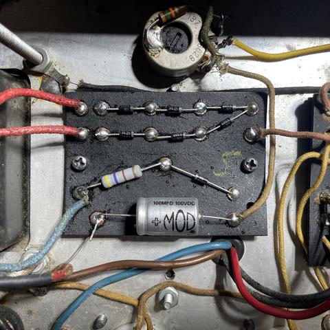 The rebuilt rectifier and bias board of a 1968 Fender Twin Reverb guitar amplifier. The board is clean with new components, fresh solder and neat lead dress.