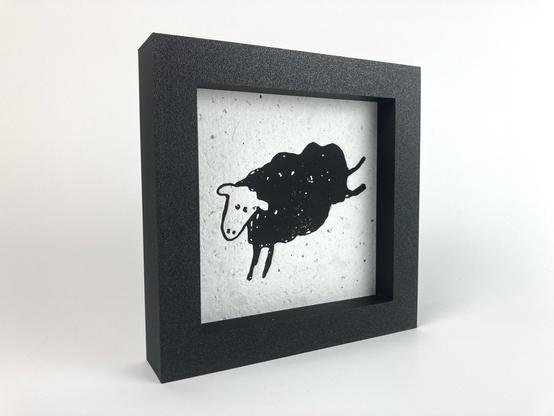 A framed relief print of the sheep found in the lower left corner of Minor Threat’s “Out of Step” album.