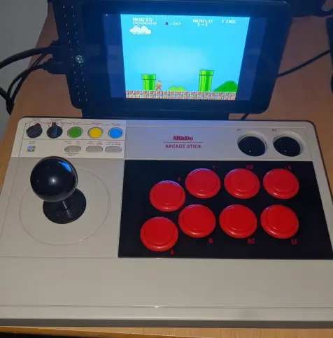 As it says in the toot, playing the original Super Mario Brothers. Giving off nostalgia vibes.