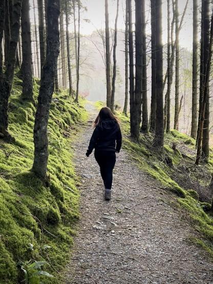 A girl walking in the woods