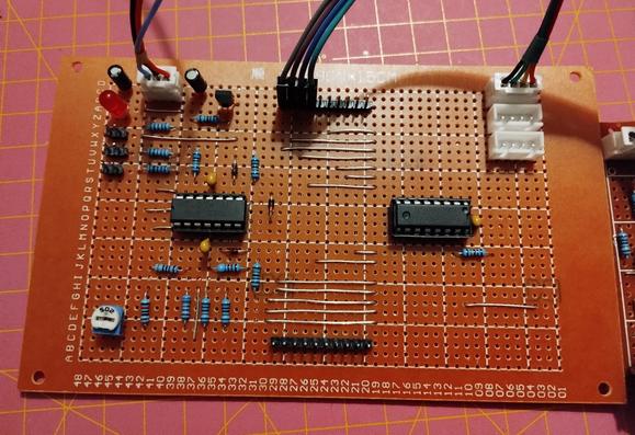 the finished board from the front. on the left is the TL074 OpAmp, and on the right the CD4017 decade counter. at the bottom is the reset selector and on the top the step outputs. on the upper right are the connectors for power and return path of the control boards. on the left are the clock input, gate and CV output