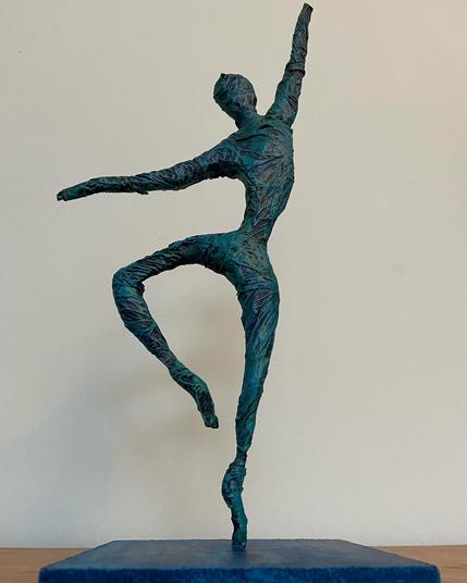 Sculpture of a dancer: on tiptoe, left arm raised high, right arm pointing down