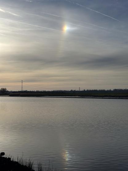 A sundog reflecting in the water of the Hollandse IJssel.