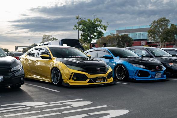 Yellow compact sedan and blue compact sedan.