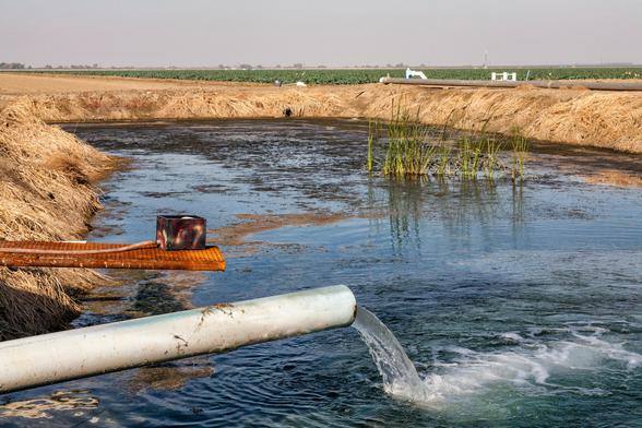 photo - pumped groundwater  entering a surface pond via a pipe