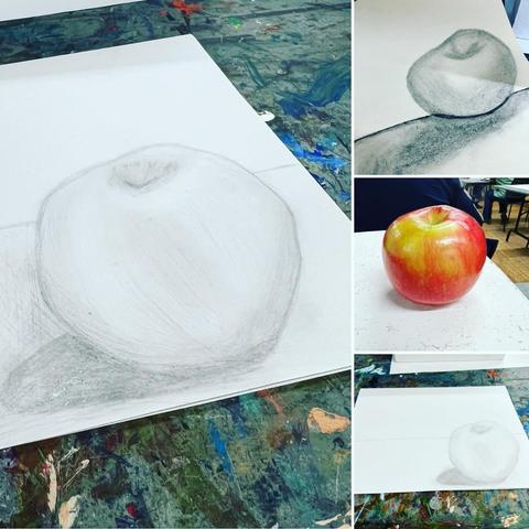 A series of drawings in pencil and charcoal of an apple with a comparison picture of the red and green apple in the middle