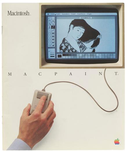 Photo of a booklet cover. The word “Macintosh” at top. A photo of a hand on a mouse with a cable connected to a screen. On the screen is a screenshot of the MacPaint interface of tools and patterns. The graphic on the canvas is a bitmap version of an Uikyo-e print of a woman combing her hair. Below the illustration: “MACPAINT”.