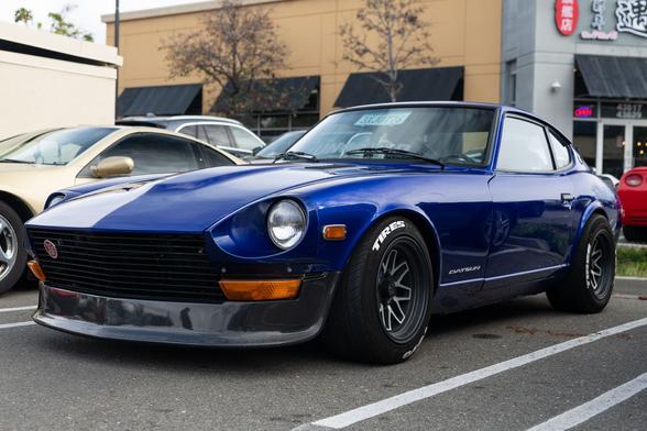 Dark blue restored Japanese sports coupe.