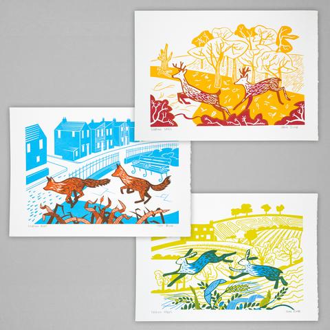 Three screenprints, each in two colours. The top one shows two leaping stags in red on a yellow background of trees. The middle one shows two orange foxes leaping over grasses with houses in cyan in the background. The bottom one shows leaping hares in blue and green with fields in yellow behind.