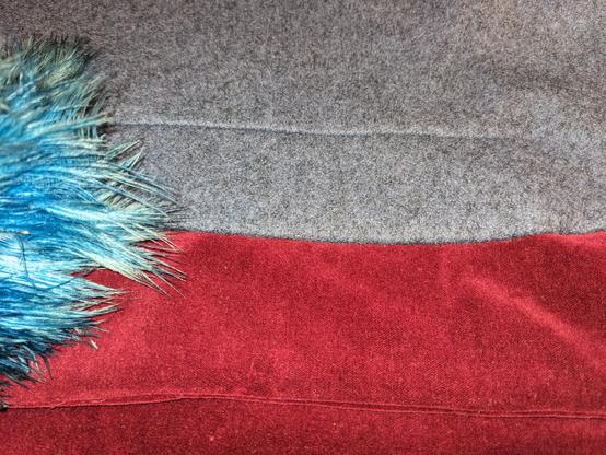 Velvet meets boiled wool for a smooth seam. In spite of trying a bright turquoise feather duster to make my colour balance better, the burgundy velvet is still very light and almost scarlet.