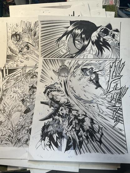 Posted by Johji Manabe himself on his twitter. A photo of some manga pages, finished and toned. Among other things, we can see a scene where a dark skinned woman has punched a monster, complete with impact showing.