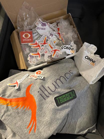 T-Shirt with illumos logo and stickers (DTrace, pkgsrc, Tribblix, OmniOSce)