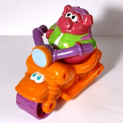 Trixie Wobnobbin, a maroon pig on an orange motorcycle, from Weehicles set (2004)