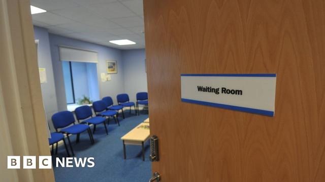 Waiting Room door open with chairs arranged around the wall.