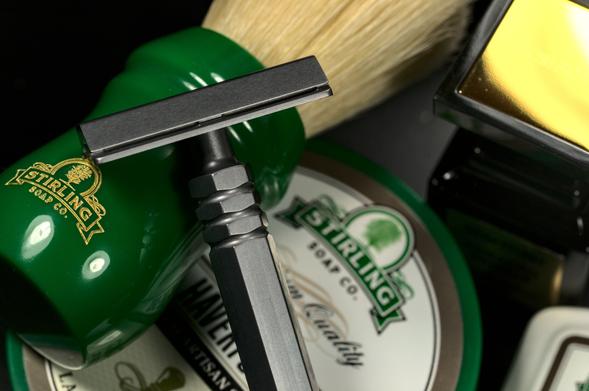 An Alumigoose leaning on the ginormous handle of a Stirling × Zenith boar on top of a tub of Stirling Haverford soap