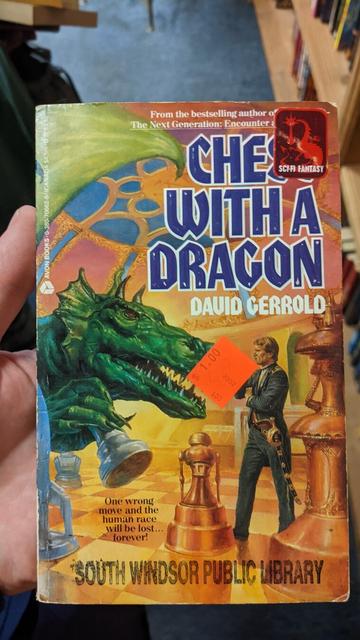 a dramatic pulpy looking book called "Chess with a Dragon". A caption reads "One wrong move and humanity with be lost... forever!"