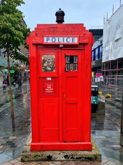 A red police box on Sauchiehall Street in Glasgow.