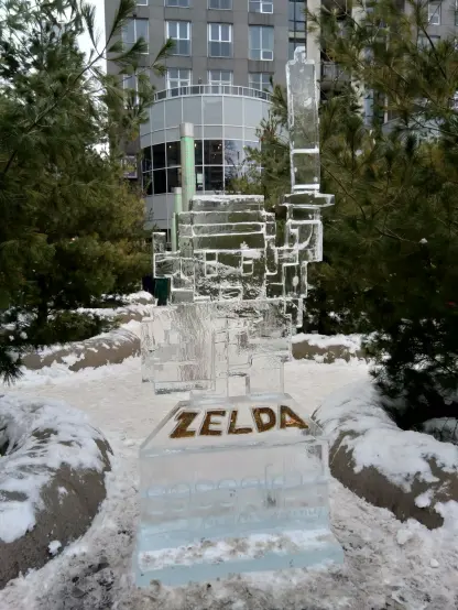 A picture of an ice sculpture in the shape of Link from the Legend of Zelda series. It's his '80s self with red lettering below in ice that says, "ZELDA".