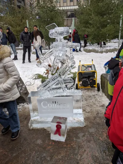 A picture of an ice sculpture of the robot from "Short Circuit". Below him is an award ribbon frozen in ice.