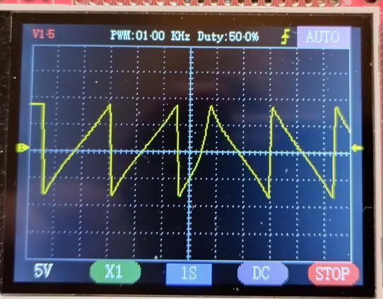 oscilloscope showing the output of the triangle wave with shape pot turned to both extremes. on the left a ramp wave, on the right a sawtooth wave. the edges are almost perfect