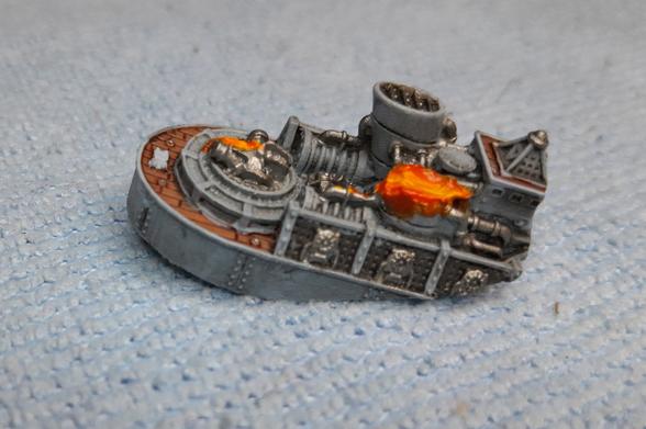 miniature wargame ship sinking, aft gun and smokestack slagged by a laser