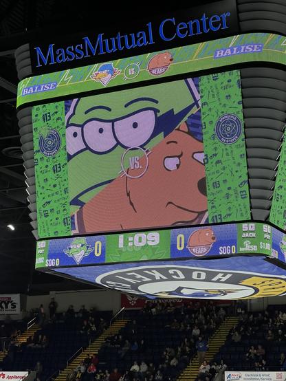 A large stadium display. Its screens show graphics and matchup information for the Springfield Ice-O-Topes (normally the Springfield Thunderbirds) and the visiting Hershey Bears of the AHL at the MassMutual Center in Springfield, Massachusetts.