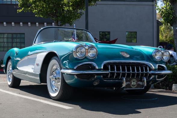 Light blue metallic convertible.