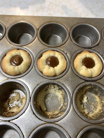Overhead shot of a mini muffin tin with 3 of the aforementioned "treats."
