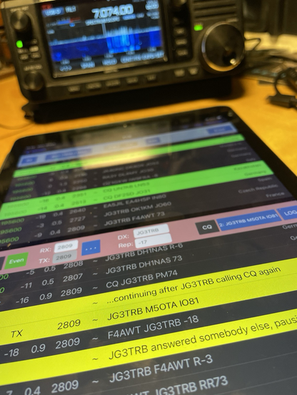 An iPad in the foreground showing FT8 screen in the SDR Control app, IC-705 in the background.