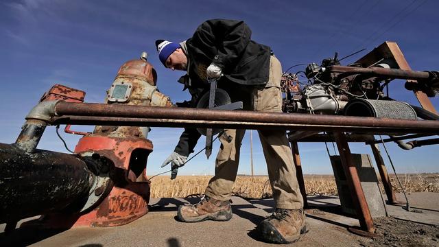 photo - technician checking a groundwater well / pump