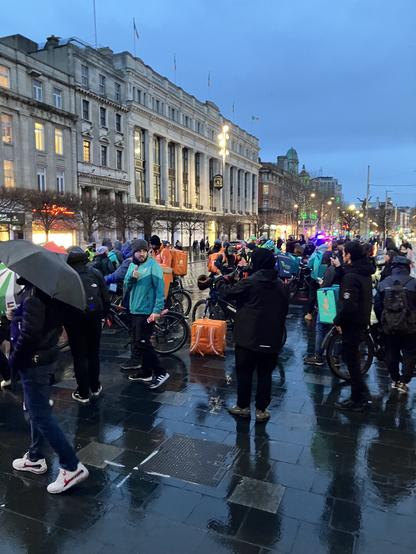 Assembled delivery workers prepare to set off on their slow demonstration through Dublin city, from O'Connell Street.