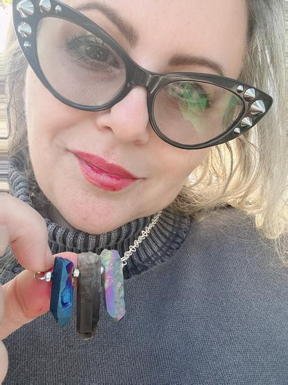 Me holding a crystal necklace
