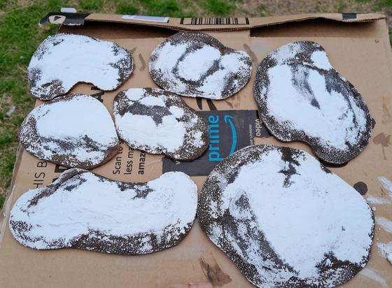 miniature wargaming terrain.  snow covered rocky islands on a cardboard box