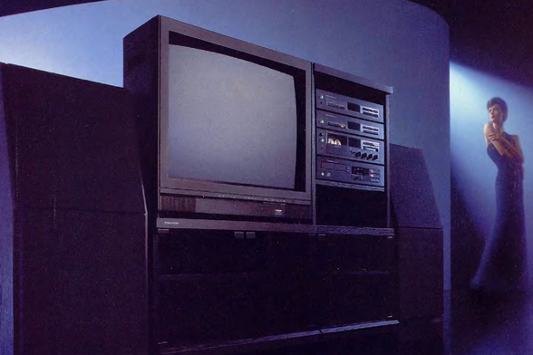 1988 A television and a stereo

In this image, we see an indoor setting with a television and a stereo in the foreground.
The television is a flat-screen display device, mounted on a wall with a clothing rack hanging on the wall next to it.
The stereo is placed on a stand below the television.
The room is well-lit with natural light coming in from a window on the right side of the image.
The television is turned on and displaying a screen with text on it.
A person can be seen standing in front of the television, possibly watching it.
The overall color scheme of the image is warm and inviting, with a mix of neutral tones and pops of color from the clothing and the television screen.

#photography #illustration #madman #nocontext #sfw #indoor #wall #clothing #text #displaydevice #televisionset #television #person #standing #screen 

https://nocontext.loener.nl/fullpage/04-April1988-Page-054.png
