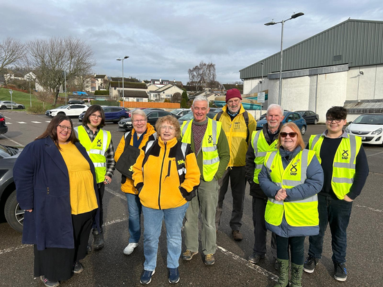 Activists assembled in Dingwall Sports Centre car park ready for postcarding