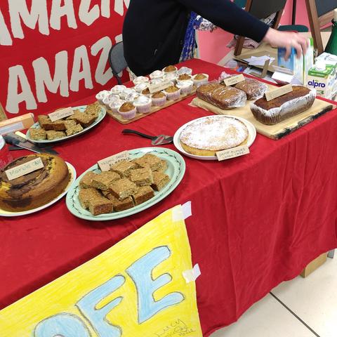 A cafe stall with a selection of handmade cakes and flapjack